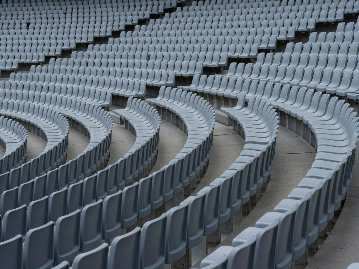 Curved rows of polypropylene stadium seats in empty grandstand